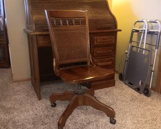 Small oak S curve roll top desk with chair.  Available for presale.  $200