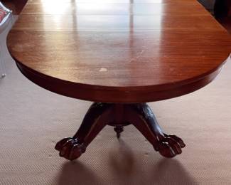 Traditional Oval Pedestal Dining Table with Carved Claw Feet