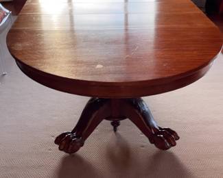 Traditional Oval Pedestal Dining Table with Carved Claw Feet