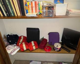 Books, American Airlines items, small tv