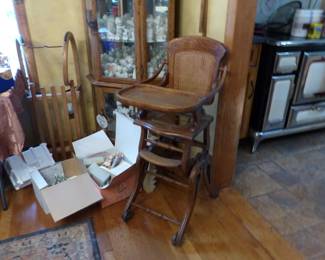 Antique oak & cane convertible highchair, antique wood sled toboggan, curio cabinet, 