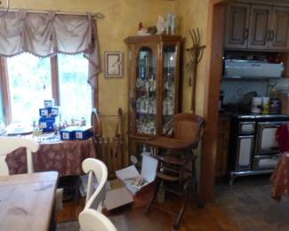 Antique oak & cane convertible highchair, antique wood sled toboggan, curio cabinet, collection of Precious Moments