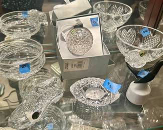 Waterford Crystal: Time Square ornament $25, Notre Dame football paperweight $300, 6” golf shoe paperweight $40, high/ small pedestal bowl $40x low bowl $25, seal pie whistle $30