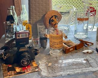 VINTAGE CANON T50 CAMERA, VINTAGE MEXICAN STRING MARIONETTE PUPPET, HOOTERS MUG, SCHLITZ BEER PITCHER, COKE BOTTLES