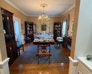 dining room loaded with glass, china, dining table, cabinets, etc.
