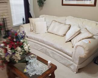 Two matching white sofas plus coffee table and end table