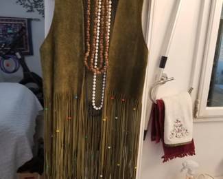 Suede vest with beaded fringe and a pair of bell bottom Jean's for the hipster in you