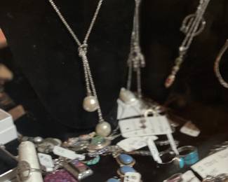 Too much jewelry to name.