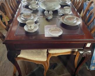 This is actually a large desk with leather inlay.  Drawer on left side.  Can easily double as a table for 8! $200