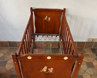 Antique cradle has wheels