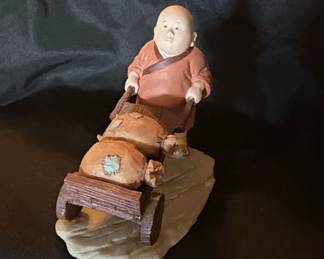 Monk Pushing Cart with Sacks Figurine