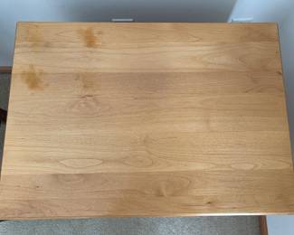 Top of nightstand shows blemishes. 