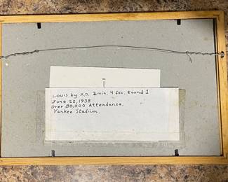 Note on back of frame for fight poster.