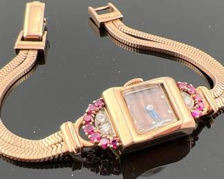 Ladies 14kt rose gold Stauffer Art Deco watch with diamond, ruby and gold band