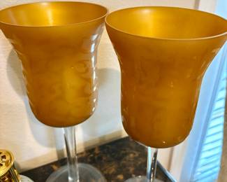 This is a pair of vintage Italian Empoli amber glass tall stemmed candle holders. $35 Each