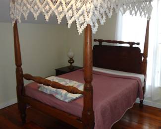 Tester Bed (at one time a rope bottom bed) with canopy. Tester means a 4 poster bed with a canopy.  they used to hang curtains to add warmth and privacy back in the day.