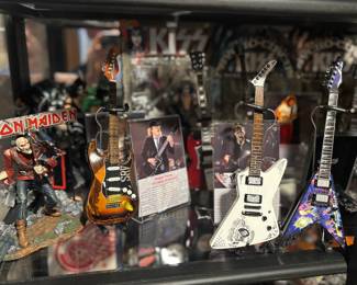 Miniature collectible guitars and rock band memorabilia 