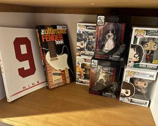 Star Wars and POP collectible figures, Alice cooper Bob Ross, Gordie Howe book, Fender guitar book