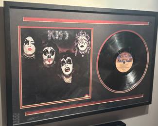 Framed display featuring the cover art and a vinyl record of the self-titled debut album by KISS, originally released on February 18, 1974