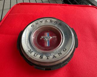 Hubcaps from a toy Mustang