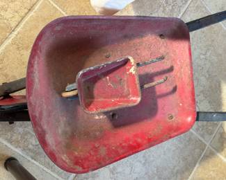 child size wheelbarrow with a mini friend