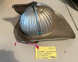 11. Cairns - Unpainted - “MRFD” Embossed - Size Unknown - Chin Strap - No Shield