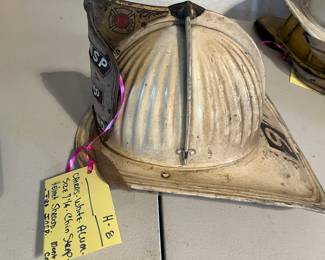 8. Cairns - White “FIRE INSP  MONT CO
MARYLAND” - Size 7 ¼ - Chin Strap- Helmet Shroud