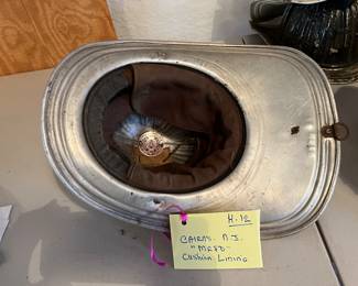 11. Cairns - Unpainted - “MRFD” Embossed - Size Unknown - Chin Strap - No Shield