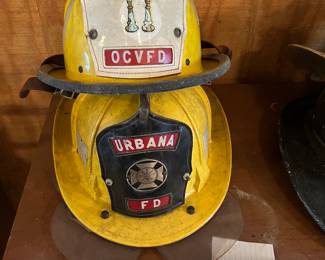 31. Cairns - Yellow - “Urbana FD” - 
Size Unknown - Chin Strap
32. Cairns - Yellow - “Captain OCVFD” - Size Unknown - Chin Strap