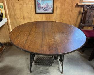 F24. Round Table-Oak Top-Singer Sewing Machine Metal Base		44”D x 29”