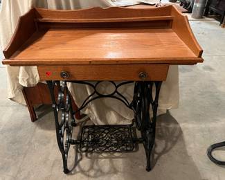 F 4. Small Desk w/Pedal Sewing Machine Base					29” x 16” x 34”