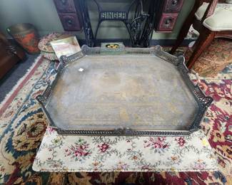 Silver tray on ottoman