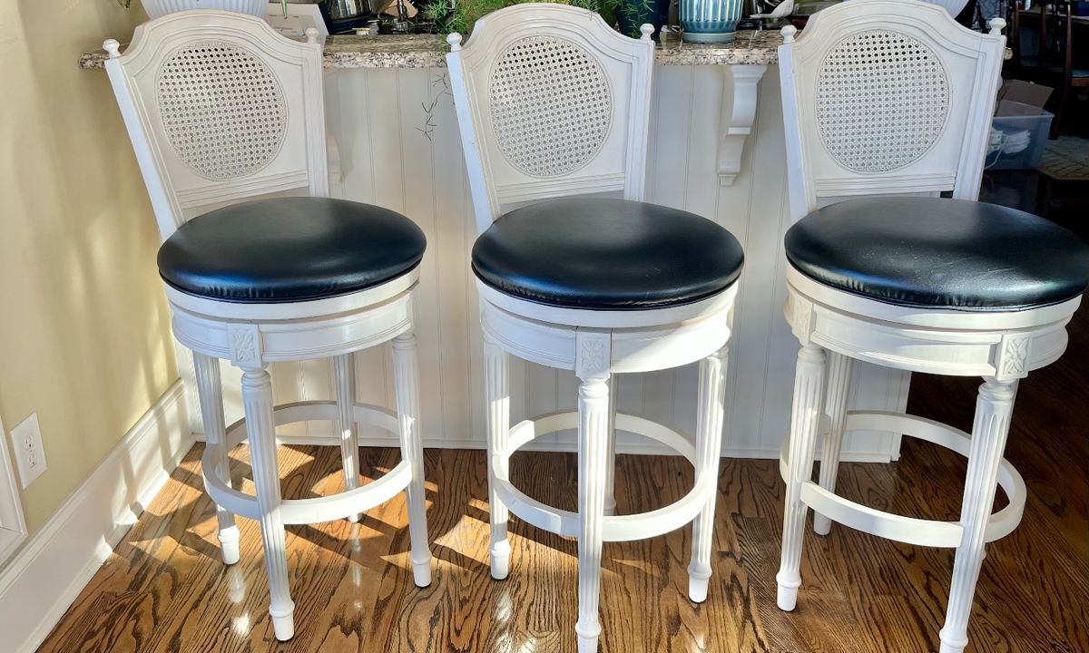 Three bar height swivel stools white with black seats. $300 for set.