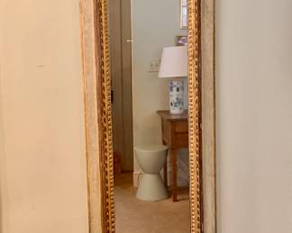 Louis XVI style gilt full length mirror.