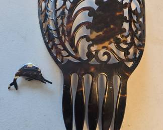 very large tortoise shell hair pick and a tiny one 