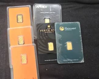 1g. Gold bars in assay card.