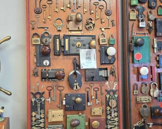 absolutely amazing vintage lock and key collection., from Girard Butler. these were made circa 1920 and the actual boards are in the photo album along with other collections Girard Butler collected. we will be selling them by the board, many of the locks have tags and dates from where they came even a lock from the 12th President Zachary Taylors home. boards are roughly 6ft long !