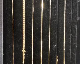 lots of gold necklaces 