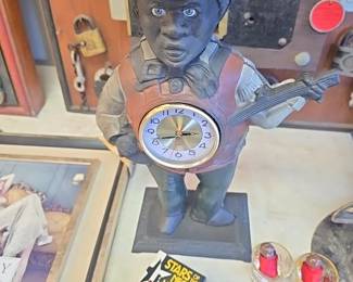 Cast iron banjo man clock 