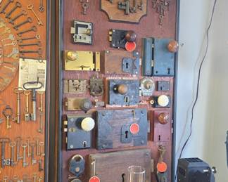absolutely amazing vintage lock and key collection., from Girard Butler. these were made circa 1920 and the actual boards are in the photo album along with other collections Girard Butler collected. we will be selling them by the board, many of the locks have tags and dates from where they came even a lock from the 12th President Zachary Taylors home.  boards are roughly 6ft long !