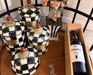 Mackenzie Childs pieces, one of several vintage bottles of wine. 