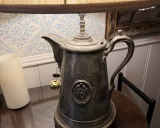 Very old water pitcher converted to lamp