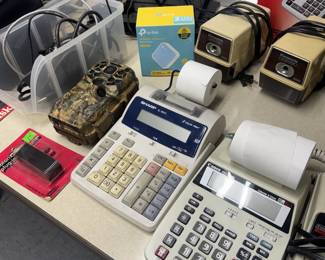 Calculators, pencil sharpeners, game camera, wireless routers