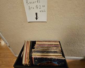 We have a room full of music, CDs and LPs 
We have ungraded records at $2 each and then we have boxes full of grated records all wrapped in plastic individually priced, music CDs without boxes are two for a dollar whereas boxed CDs are a dollar each