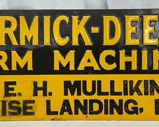 Emb. McCormick-Deering Farm Machines Metal Sign, 28in x 10in
