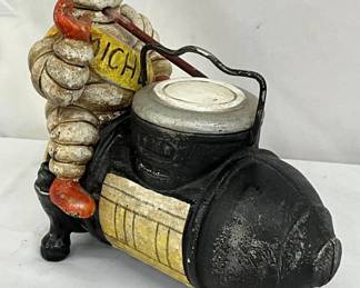 Cast Iron Michelin Man Figurine on Air Compressor, 8×8 Inches, Replica