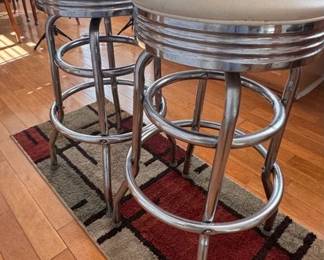 Two retro style chrome diner bar stools with vinyl seats