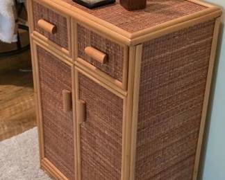 Rattan and bamboo cabinet and decorative souvenir statues and vases