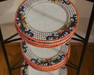 Mosaic Italian pottery plates and bowls, metal cookware stand offered separately