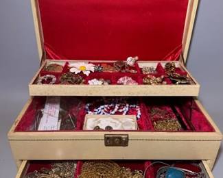 Vintage Mele jewelry box with assorted costume jewelry